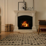 Modern fireplace with burning wood in room. Interior design