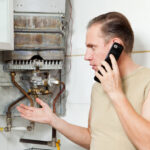 The man calls by phone to cause the repairman of gas water heaters